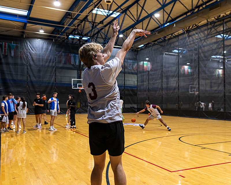 SIU intramural basketball player shoots a three pointer
