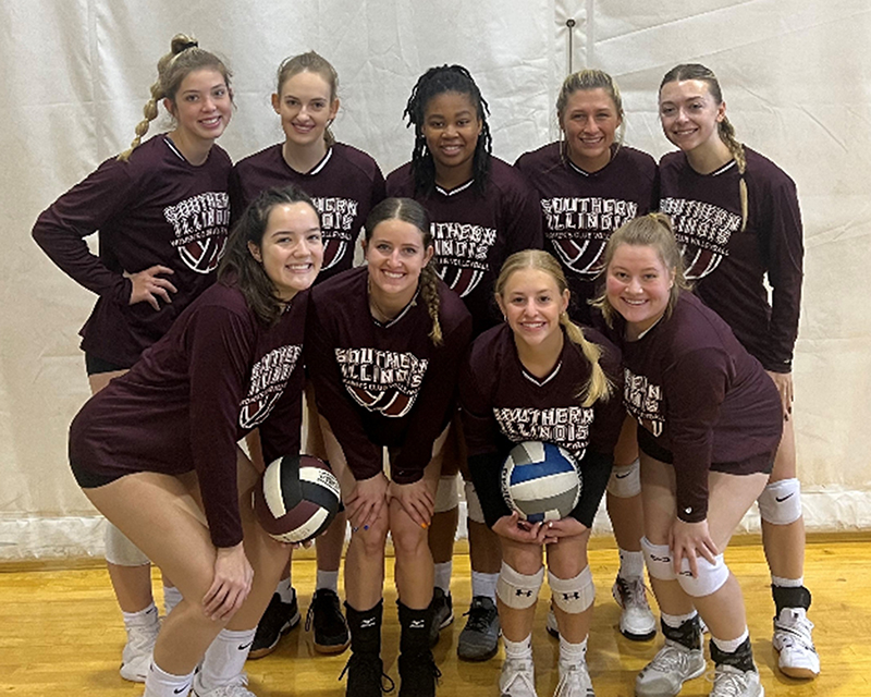 SIU women's volleyball club members pose for a photo