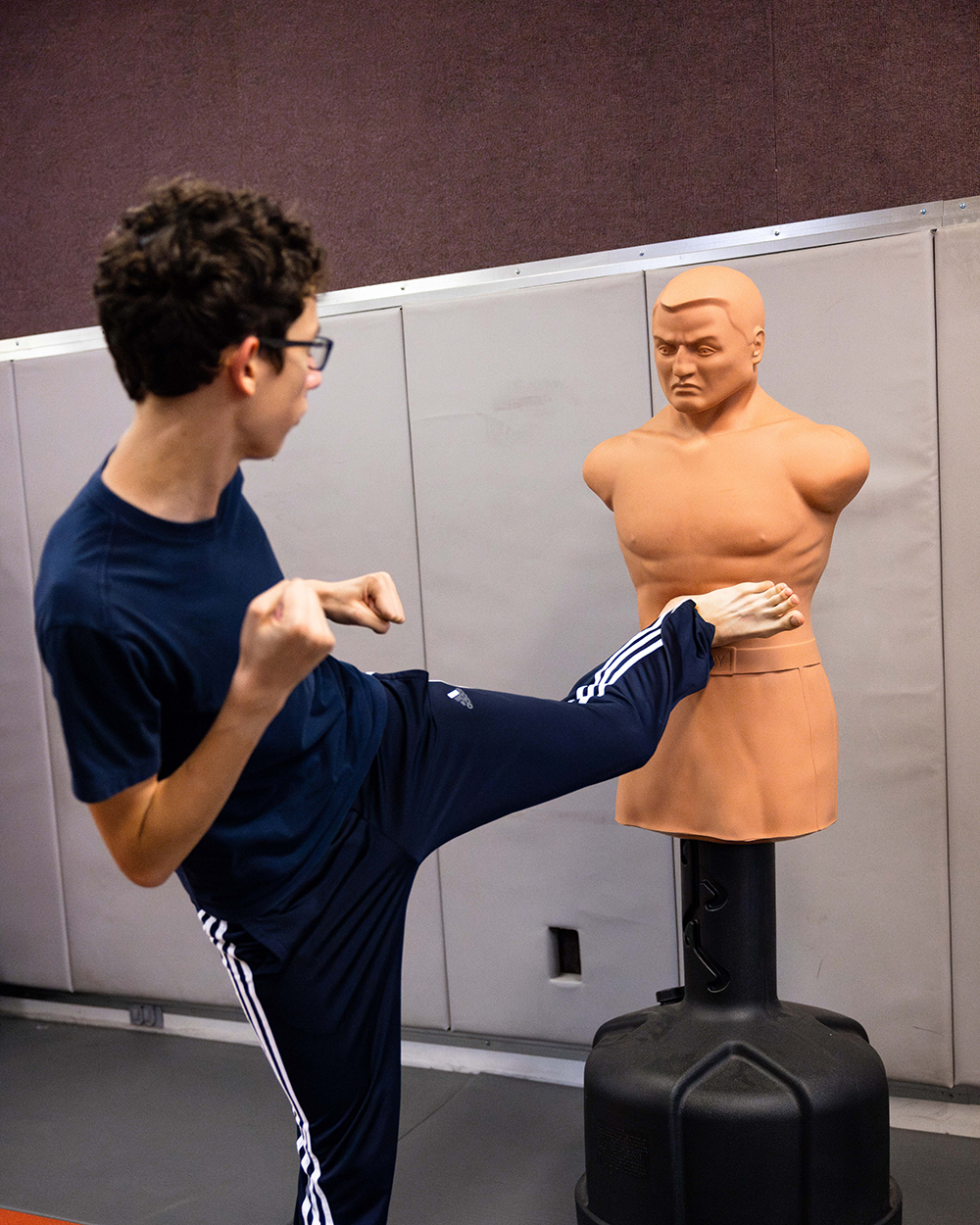 SIU student kicks a dummy during a tae kwon doe class